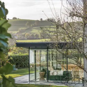 glass extension through the trees - crop