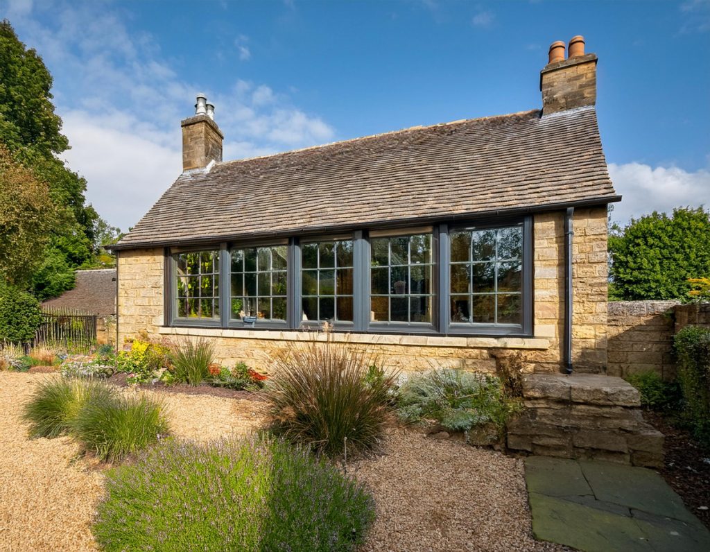 Glass walls single storey extension to Cotswold stone cottage 2 | Anderson Architects